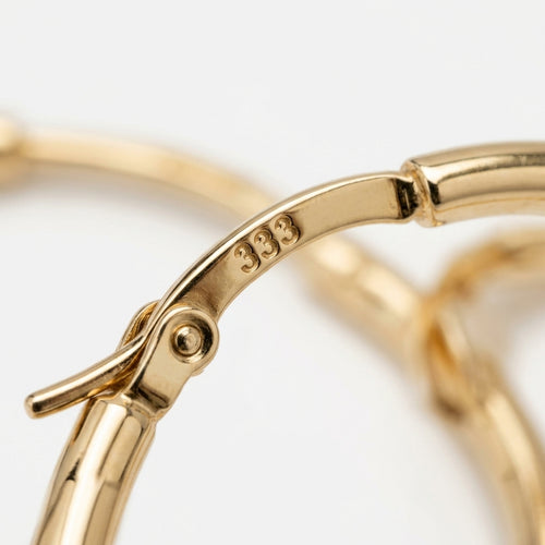 Hoop earrings — Hallmark Detail | Generated by Modelize